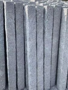 Granite kerb stones stacked, six-face finished