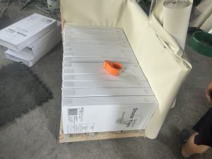 Granite thin tiles strapped on a wooden pallet