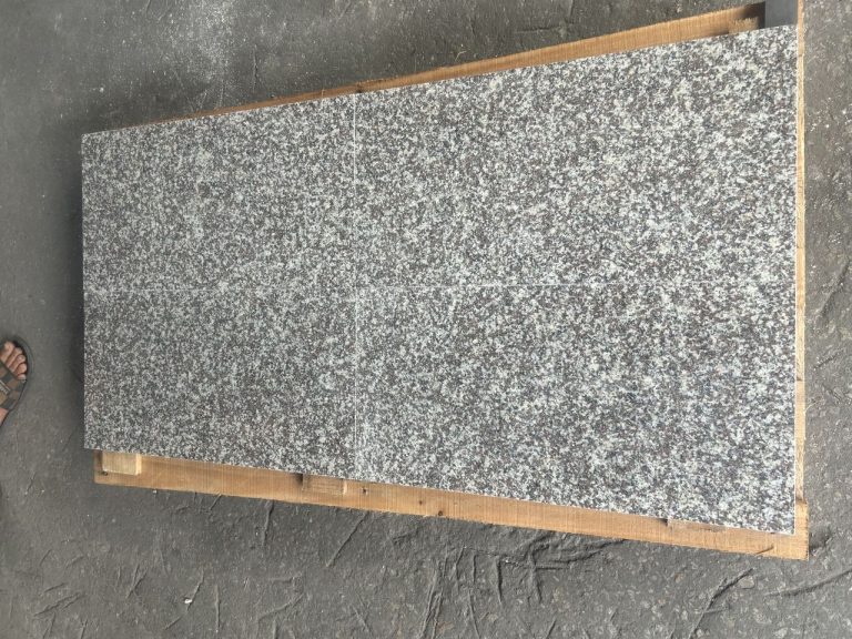 Finished granite thin tiles, face up and checked
